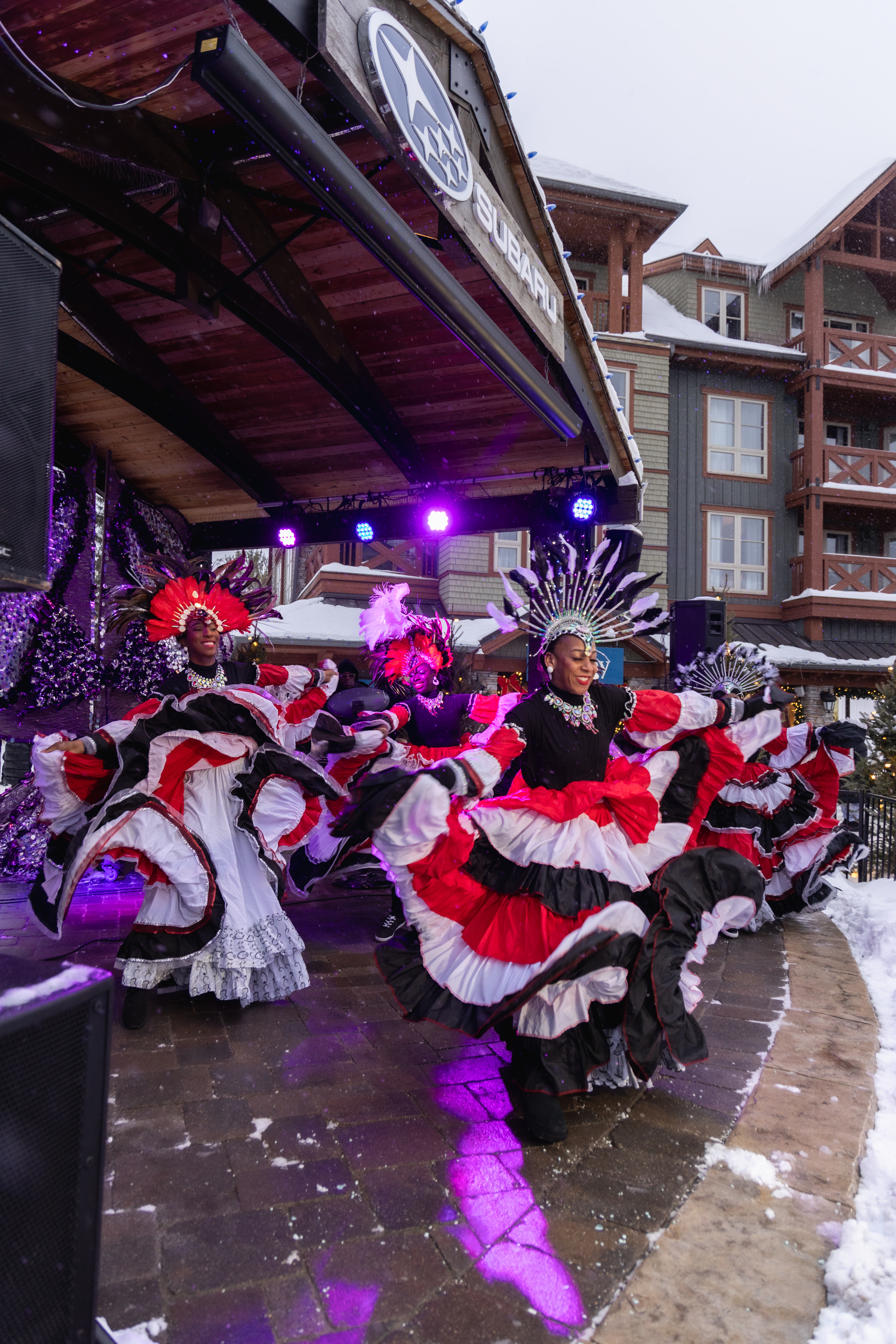 Caribbean Winterfest performers dressed in flamenco dresses, dancing on the Subaru Stage.