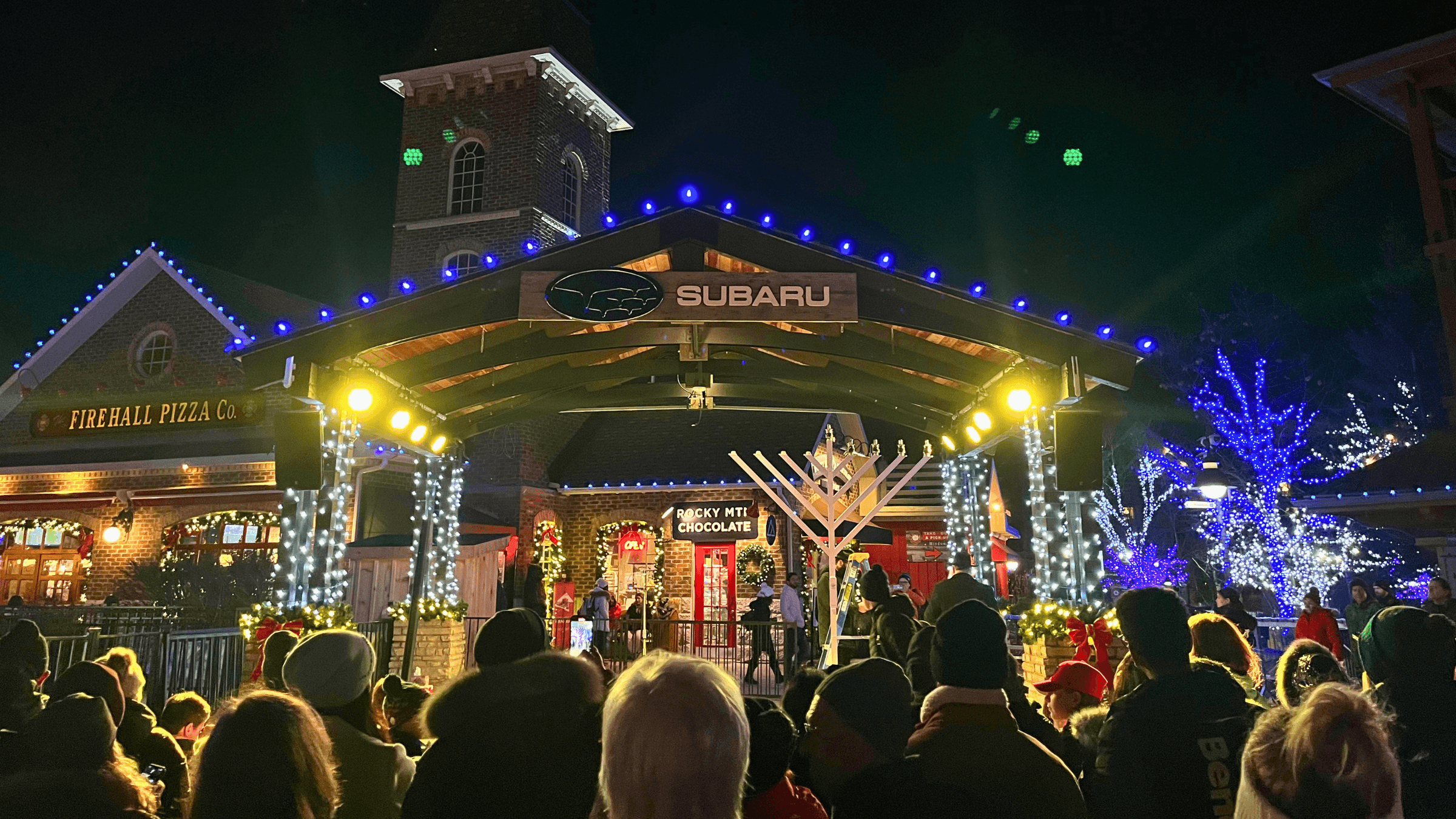 Families and friends gathered around the Subaru Stage for the Menorah Lighting Ceremony in the Events Plaza.