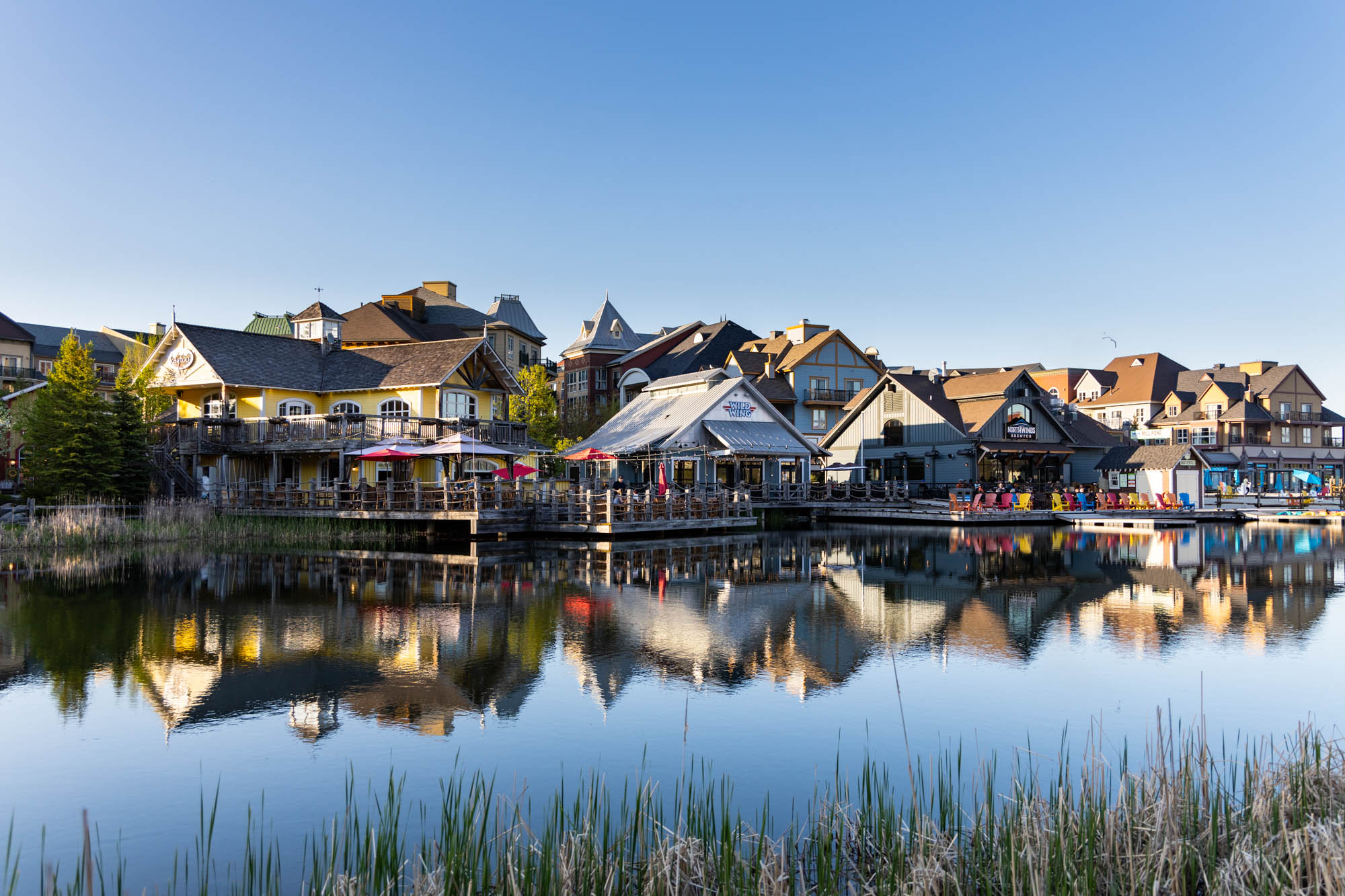 A beautiful image of Kaytoo's patios from across the pond on a still morning. 