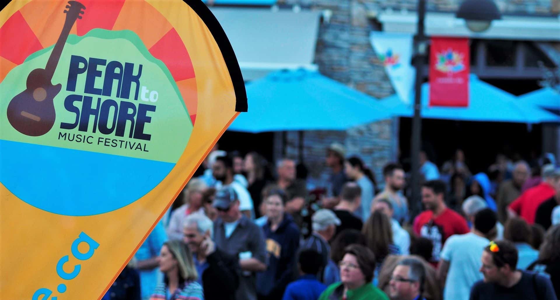 Peak to Shore event flag waving over the audience in the Blue Mountain Village Events Plaza