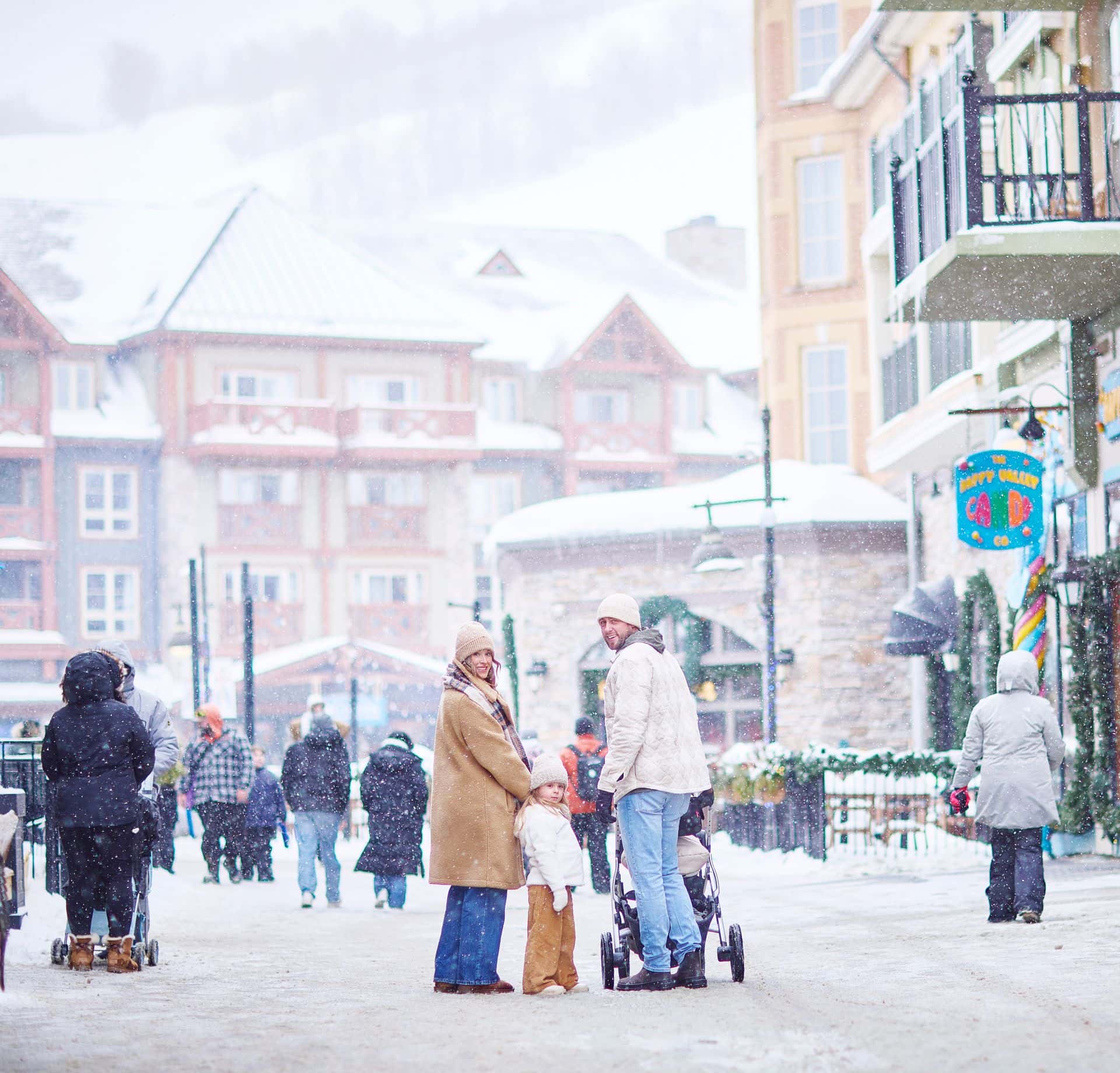 Family walking down Village Crescent on a snowy day.