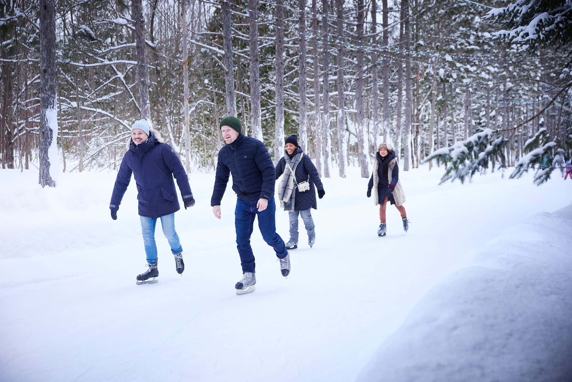 Group of friends gliding together along the Woodview Mountain Top skating loop on a Winter afternoon.