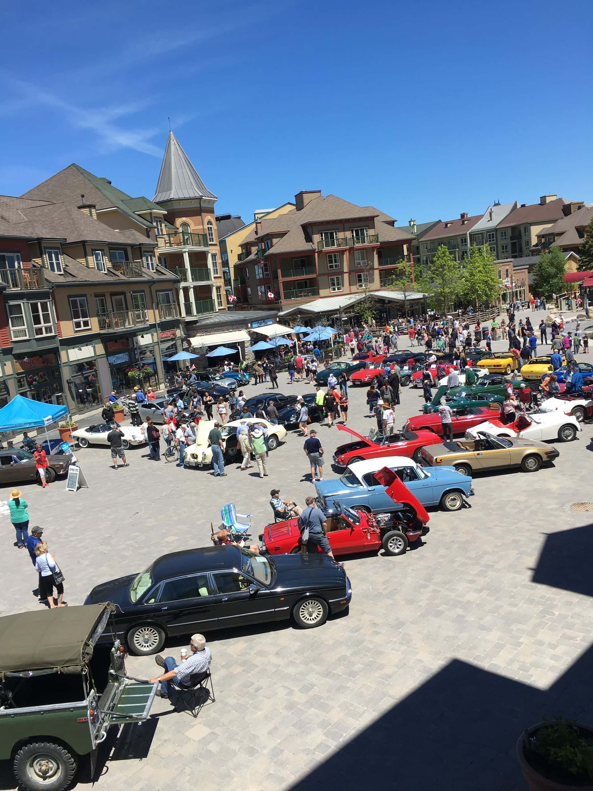 Village Events Plaza is full of classic cars during the British Car Show at Blue