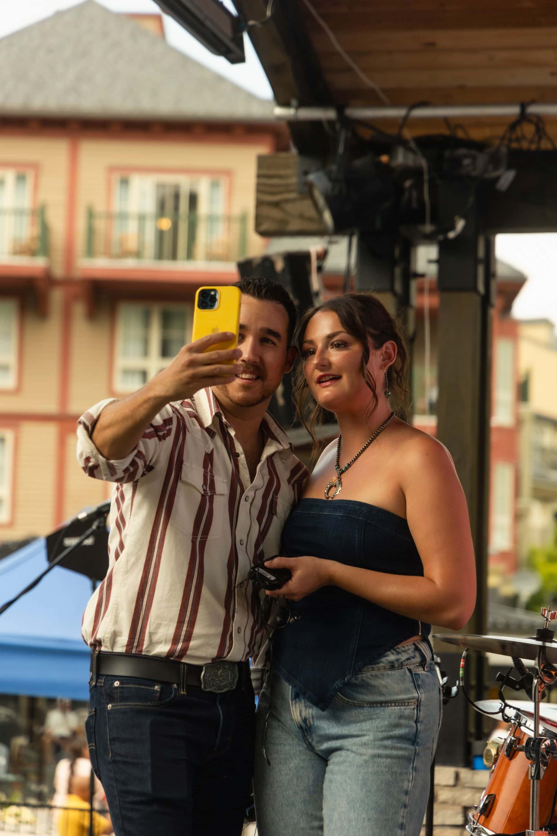 Canadian Country duo, Rosewood Ave, taking a selfie on the Subaru Stage during Country Fest 2025.