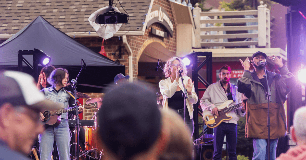 The 99s band performing live on the Subaru Stage during Guitar Trail 2025