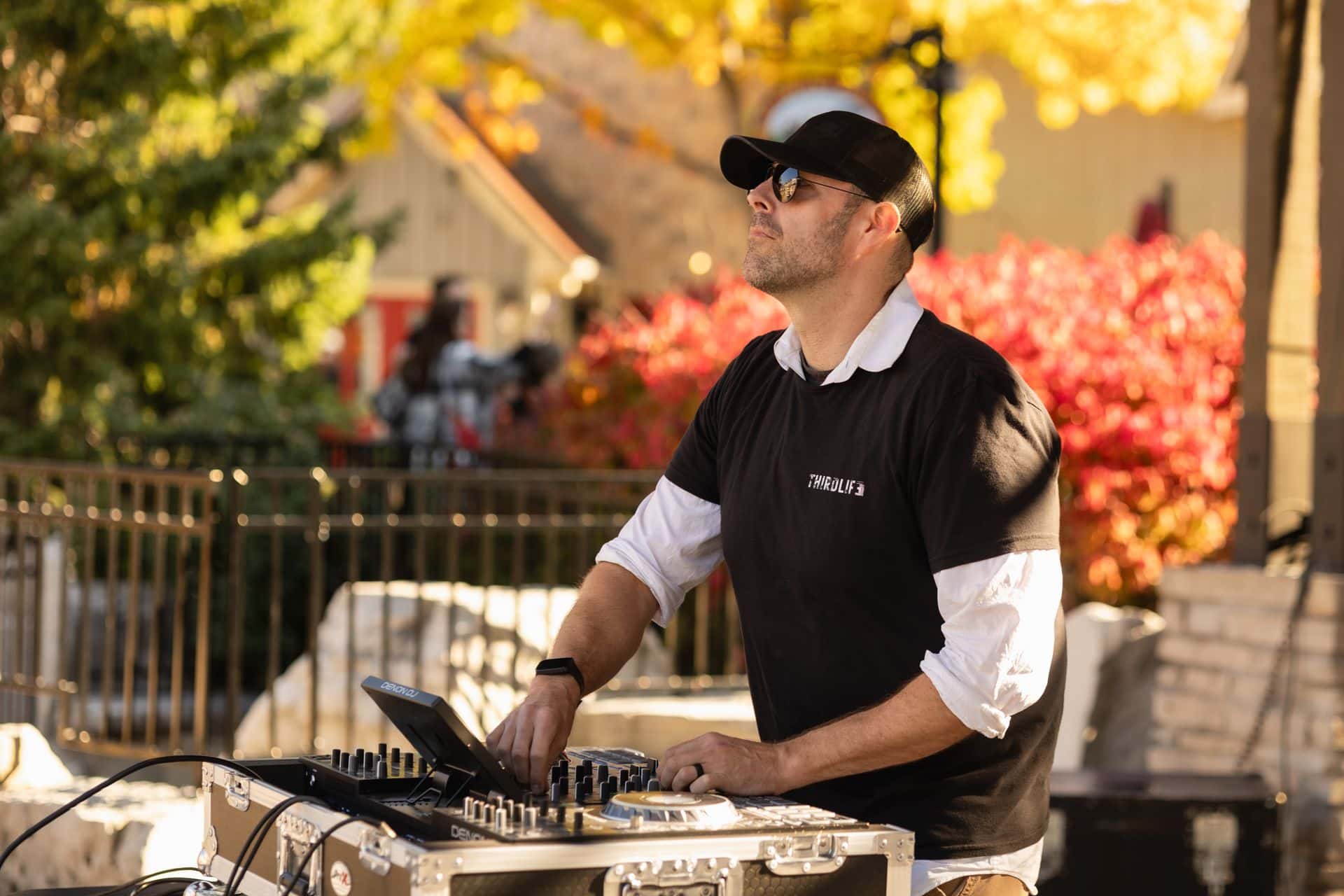 Local DJ, THIRDLIFE, performing live on the Subaru Stage on a fall afternoon in the Village.