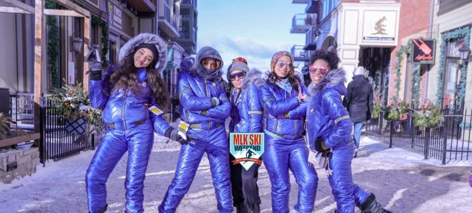 A group of women pose in the Village on MLK Ski Weekend.