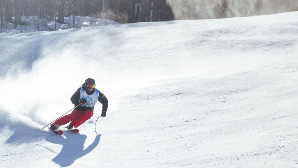A participant skiing down the mountain. 