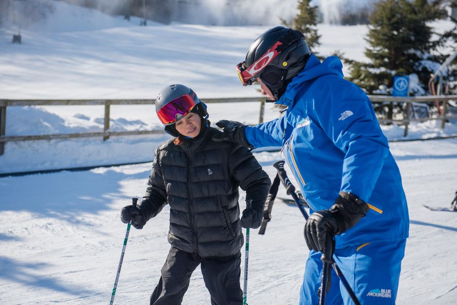 Young boy learning to ski with a Blue Mountain Instructor.