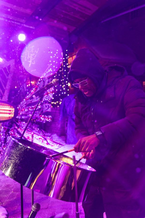 Steelpanist playing on the Subaru Stage for Caribbean Winterfest.