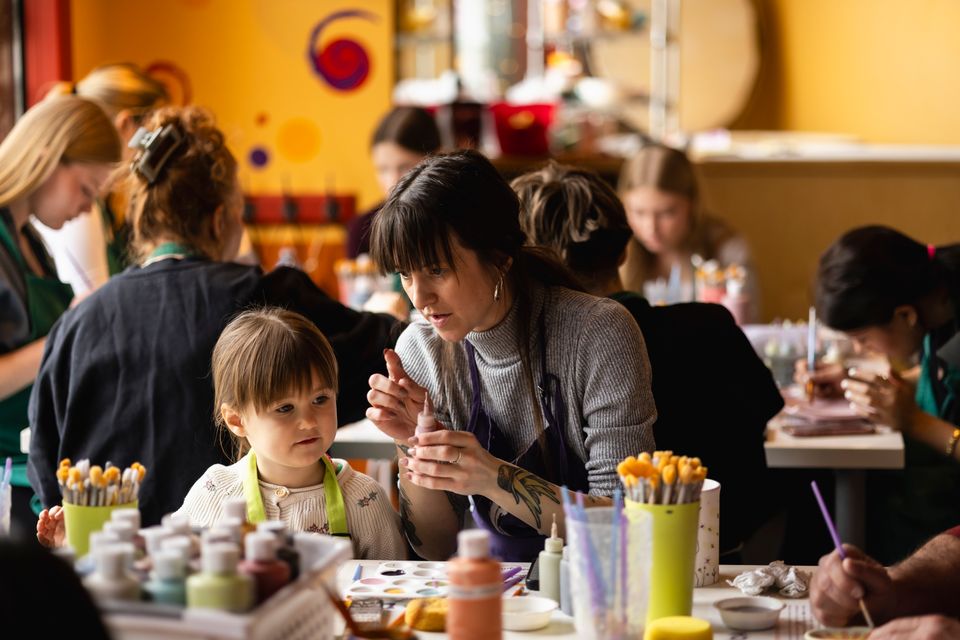 A mom and daughter work together to paint their own pottery on a chilly March Break afternoon at Crock-a-Doodle studio in Blue Mountain Village.