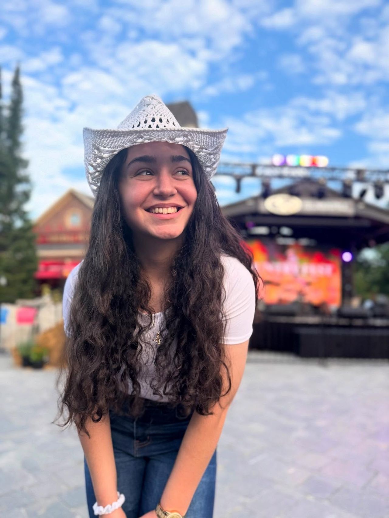 Live Band Karaoke Winner, Selena Villa, posing in front of the Subaru Stage during Country Fest 2025.