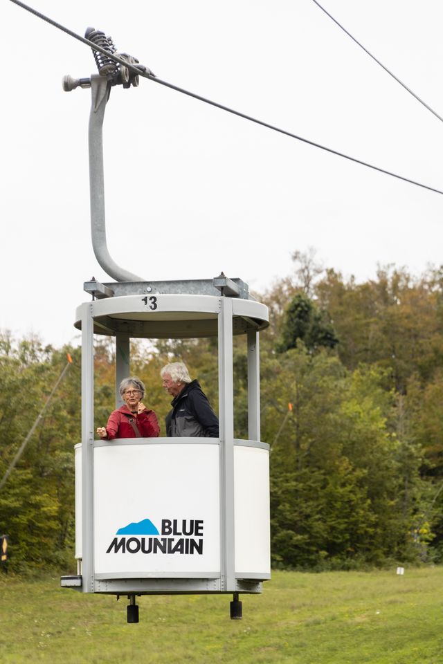 A mature couple descends down the mountain on Ontario's only Open-Air Gondola