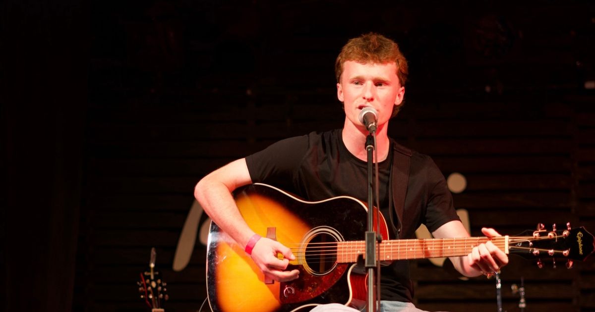 Ontario emerging country artist, Braydon Hall, performing on stage.