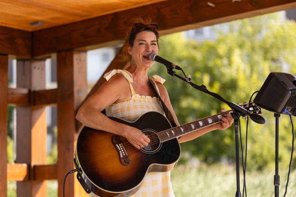 Karla Crawford performing live on the Floating Stage at the Mill Pond in Blue Mountain Village.