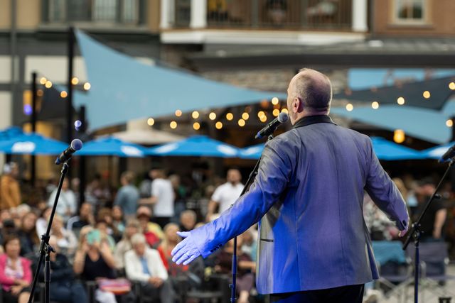 A man singing classic opera on the Subaru Stage 