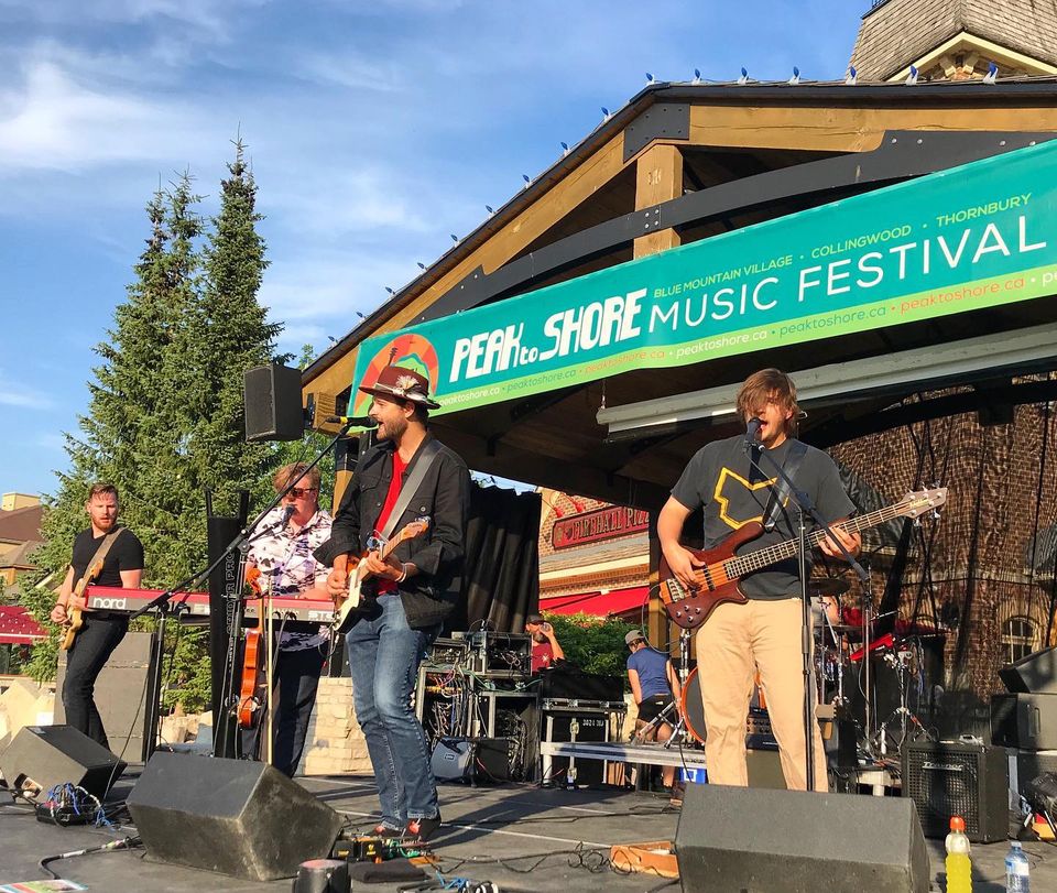 Live band performing on the Subaru Stage for Peak to Shore Music Festival
