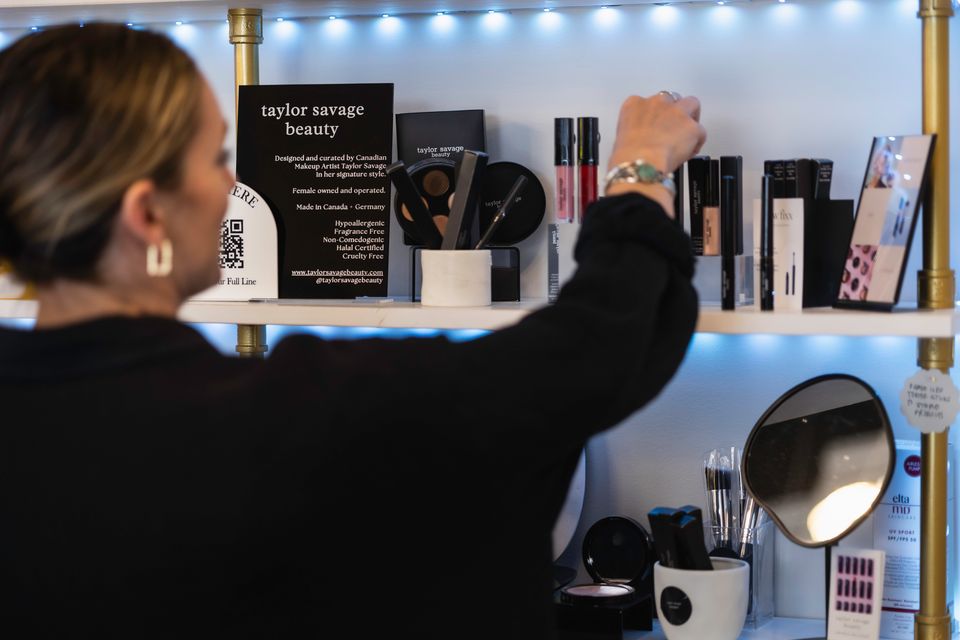Woman shopping for skincare and cosmetic finds at Beauty Bar in Blue Mountain Village