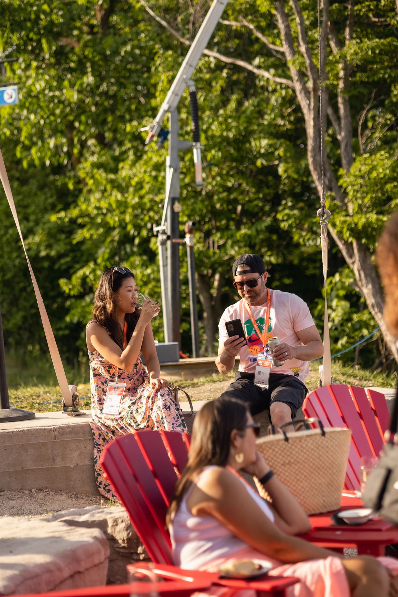 A couple sipping on some cold beverages as they soak in the golden hour lighting at Summitview Pavillion.