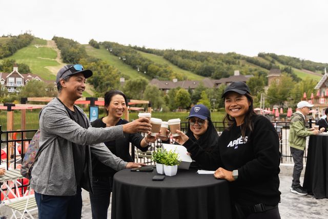 Guests enjoying signature coffees on the patio of Greekery Cafe as they enjoy live music from the Floating Stage.